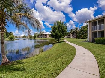 A sidewalk leading to the water at the preserve at great pond apartments in windsor
